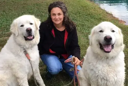 Image of Dr. Helen Sergerie with her two Great Pyrenees dogs